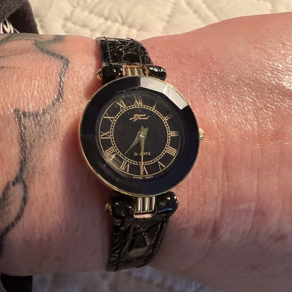 Jacques Prevard gold tone with black leather band